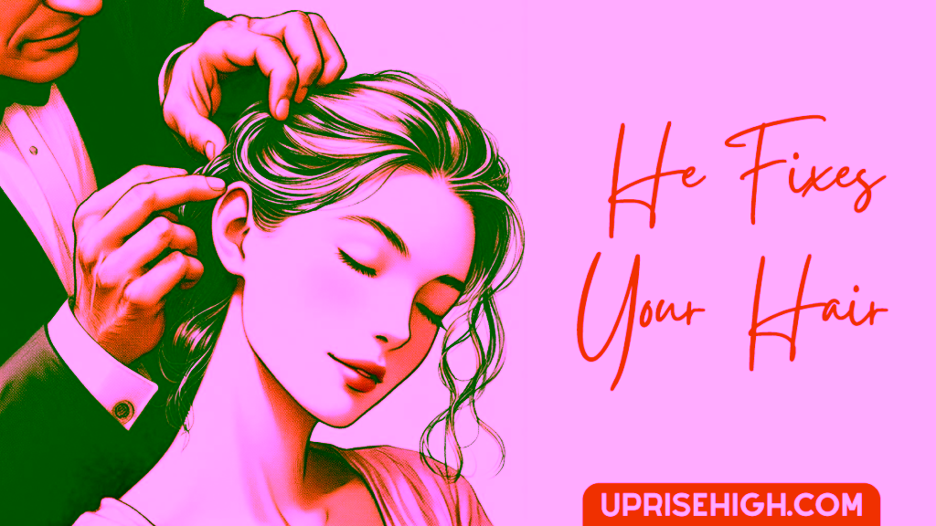 A gentleman fixing a woman's hair.