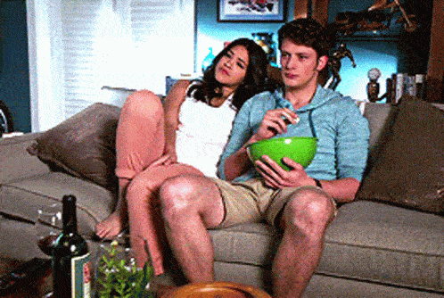 24 At-Home Date Night Ideas That Beat Netflix & Chill 1 bored couple watching tv gif