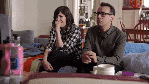 Ditch Netflix: Try These 20 Intimate Bedroom Dates 1 bored couple watching tv intro gif